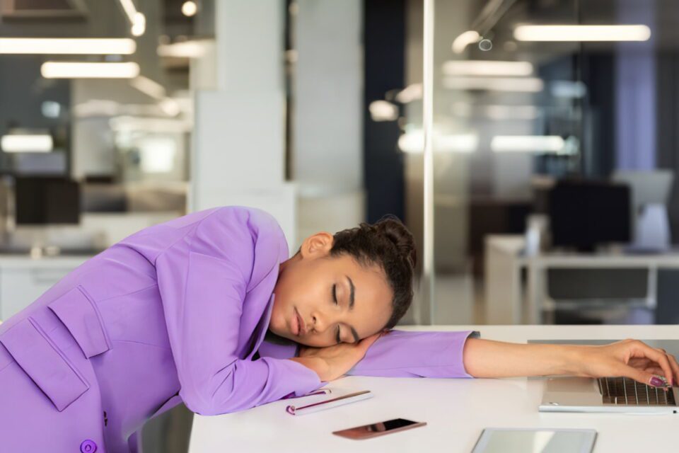 power nap, napping woman in the office